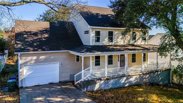 view of front of property featuring a garage and covered porch