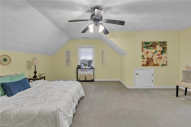 bedroom featuring light carpet, lofted ceiling, and ceiling fan