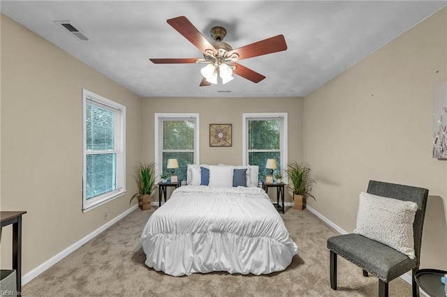 carpeted bedroom with ceiling fan