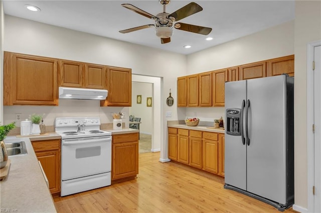 kitchen featuring electric stove, ceiling fan, stainless steel fridge with ice dispenser, and light hardwood / wood-style flooring