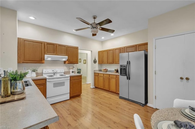 kitchen featuring ceiling fan, white electric range, stainless steel fridge, and light hardwood / wood-style flooring