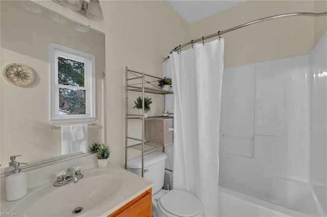 full bathroom with vanity, toilet, and shower / bath combo with shower curtain