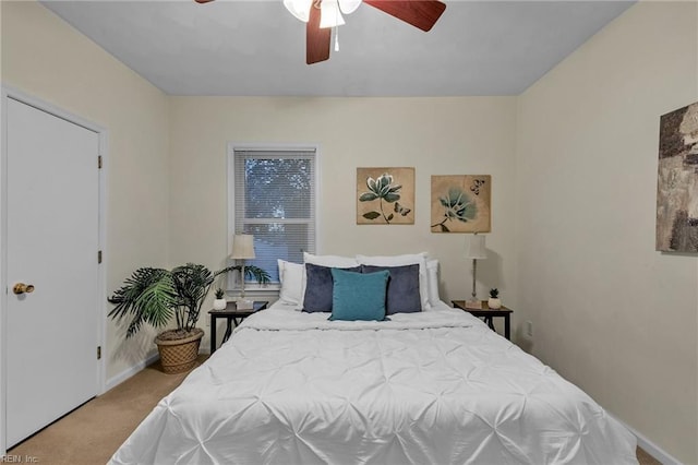 carpeted bedroom with ceiling fan