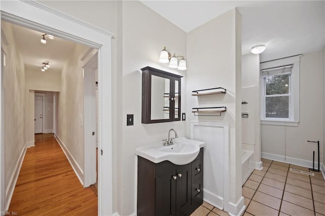 bathroom with vanity and tile patterned flooring