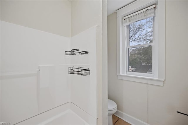 bathroom with tile patterned floors and toilet