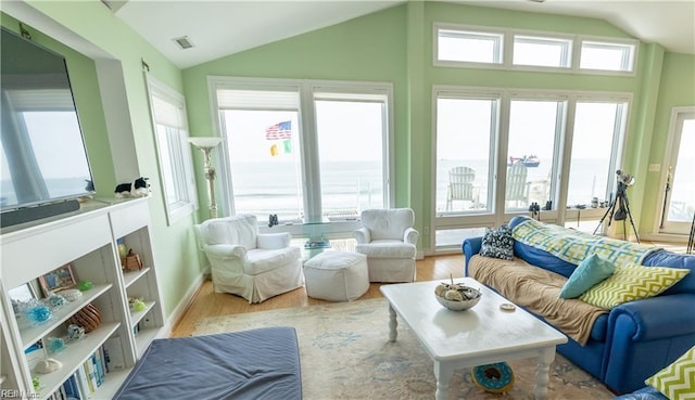 sunroom featuring lofted ceiling