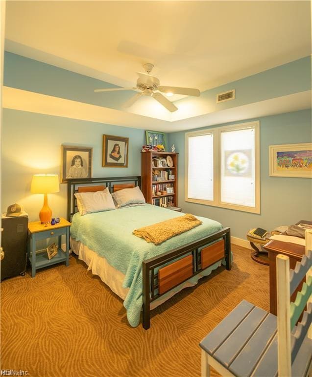 bedroom with ceiling fan and light colored carpet