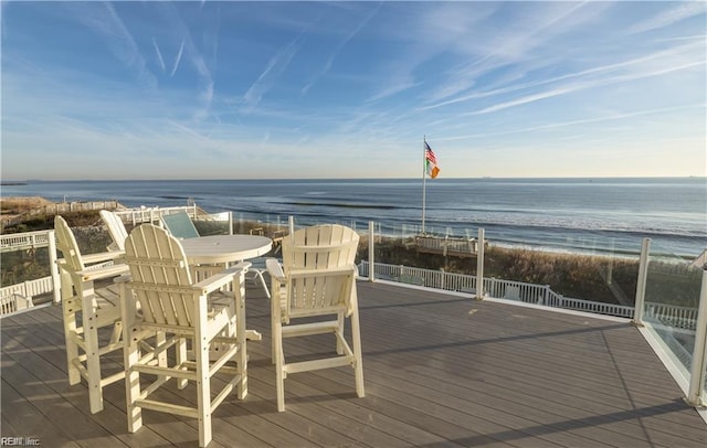 deck with a water view and a view of the beach