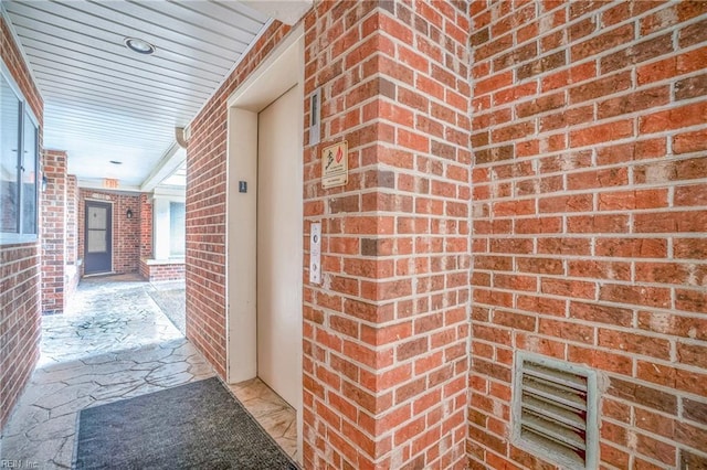 doorway to property featuring elevator