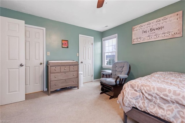 carpeted bedroom featuring ceiling fan