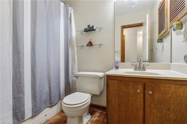 bathroom with vanity, tile patterned floors, and toilet