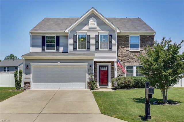 view of front of property featuring a garage and a front lawn