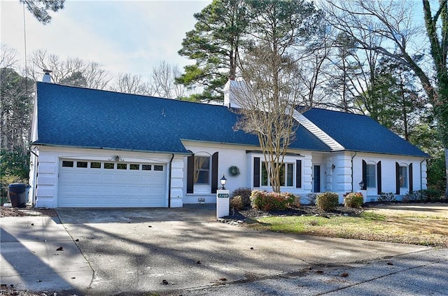 view of front of property with a garage and a front yard