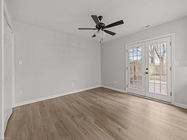 unfurnished room with french doors, ceiling fan, and light hardwood / wood-style floors