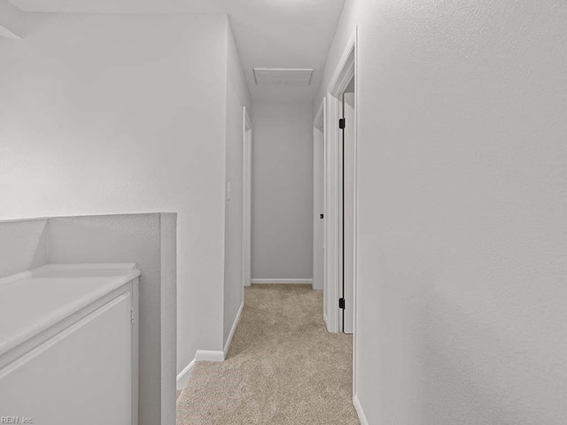 corridor with light carpet