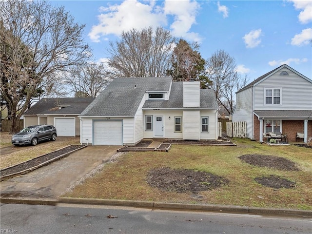 view of front of house featuring a garage and a front lawn