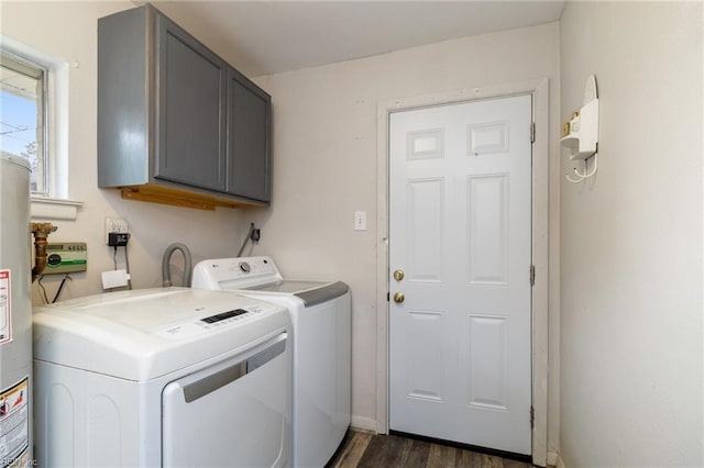 washroom with independent washer and dryer, cabinets, dark hardwood / wood-style flooring, and gas water heater