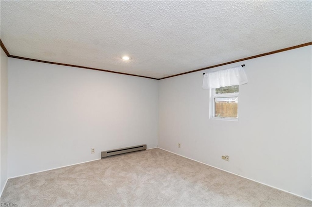 unfurnished room with light carpet, a baseboard heating unit, crown molding, and a textured ceiling