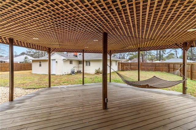 deck featuring an outbuilding and a lawn