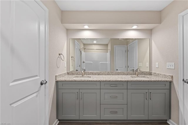 bathroom featuring vanity and a shower