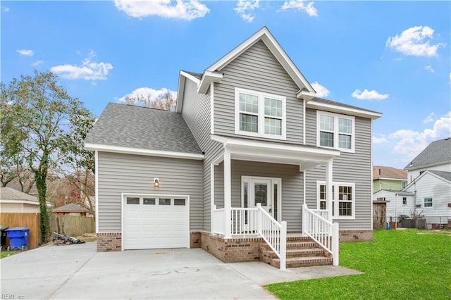 front of property with a garage and a front lawn