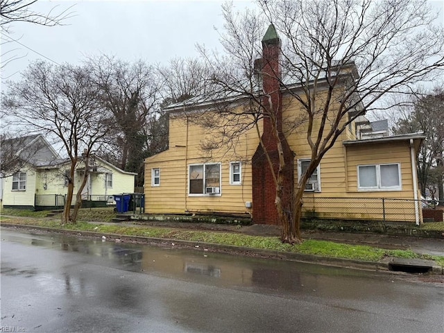 view of property exterior with cooling unit