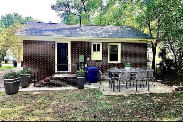 back of property featuring a patio area