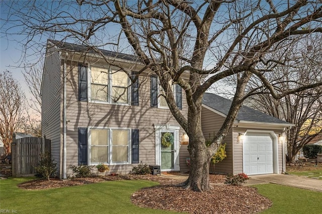 colonial-style house with a garage and a front lawn