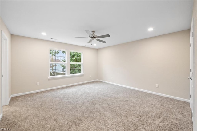 empty room featuring carpet flooring and ceiling fan