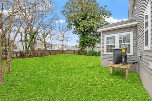 view of yard featuring central air condition unit