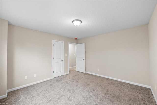 empty room with light colored carpet