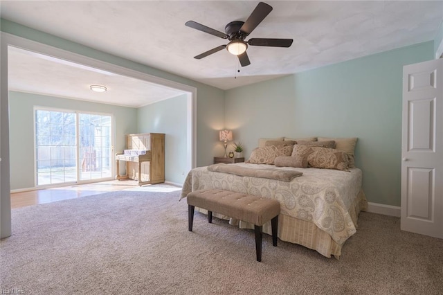 bedroom with light carpet and ceiling fan