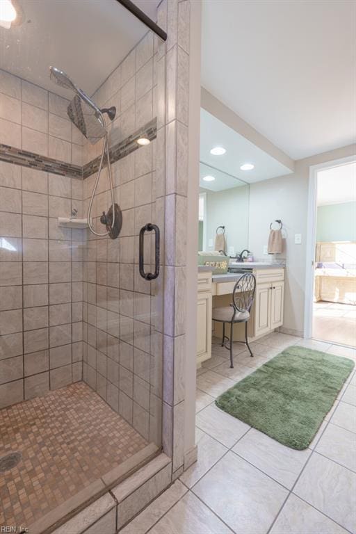 bathroom featuring tile patterned floors, sink, and a shower with door