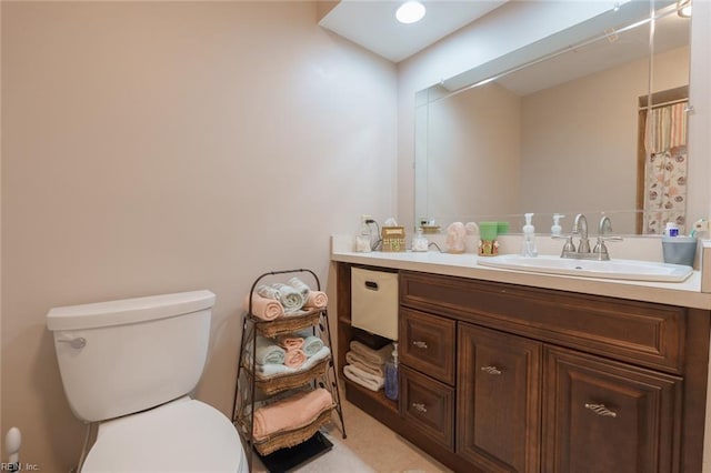 bathroom featuring vanity, a shower with shower curtain, and toilet