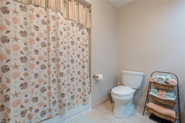 bathroom with shower / tub combo with curtain, toilet, and tile patterned flooring