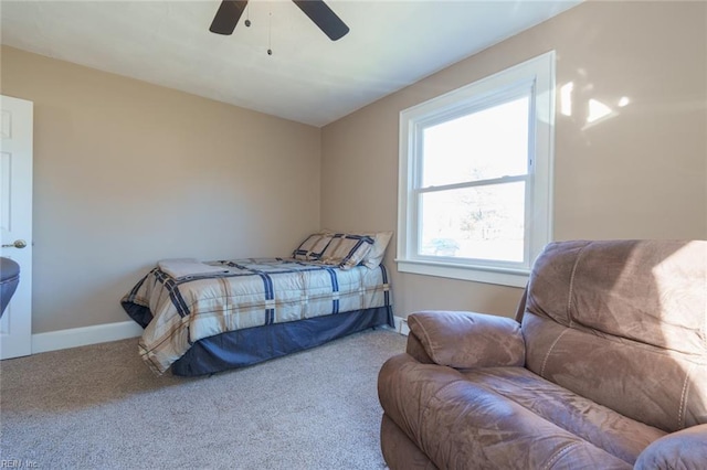 bedroom featuring ceiling fan and carpet