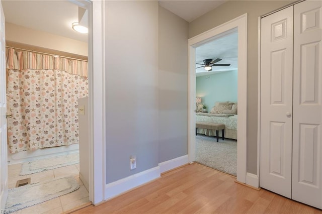 corridor featuring hardwood / wood-style floors