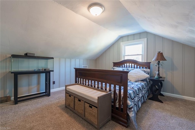 bedroom with lofted ceiling and light colored carpet