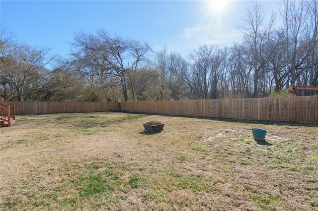 view of yard featuring an outdoor fire pit