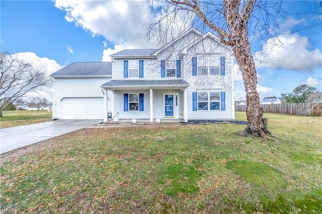 view of front of house featuring a garage, a front yard, and covered porch