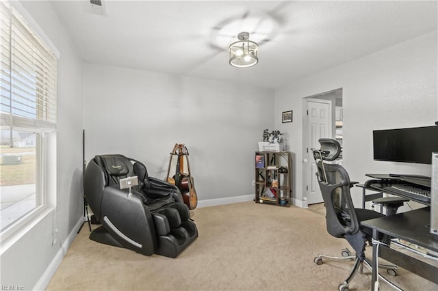 office space featuring light colored carpet and a healthy amount of sunlight