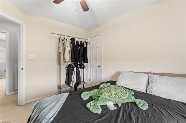 carpeted bedroom with a closet and ceiling fan