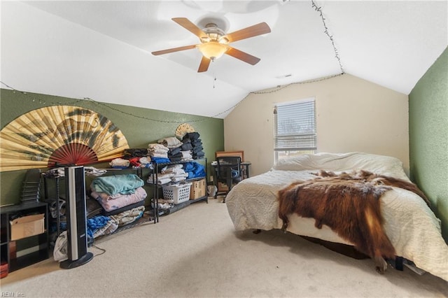 carpeted bedroom featuring lofted ceiling and ceiling fan