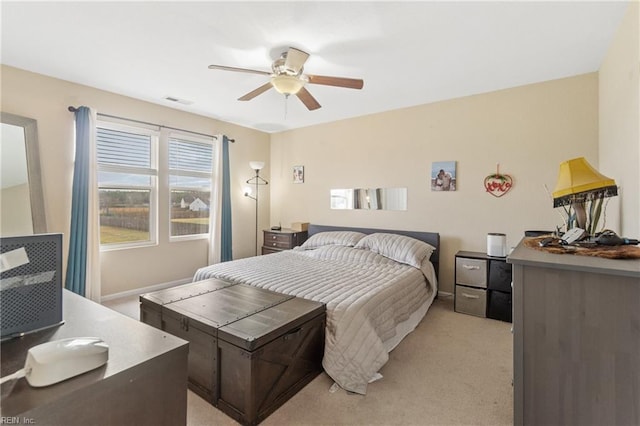 bedroom with light colored carpet and ceiling fan