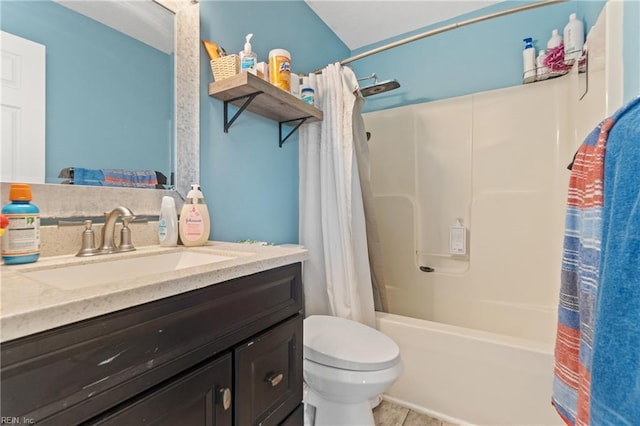 full bathroom with shower / bath combo, vanity, and toilet