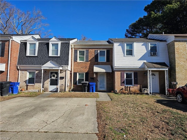 view of property featuring a front lawn