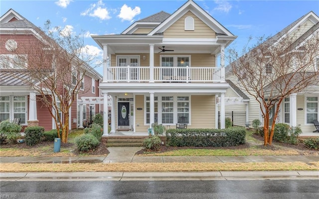 view of front of property with a balcony and covered porch