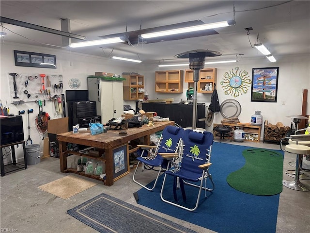 interior space featuring a workshop area and concrete floors