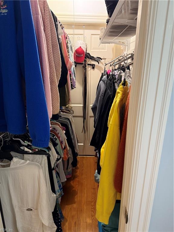 spacious closet featuring hardwood / wood-style flooring