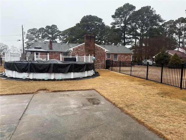 view of yard with a covered pool